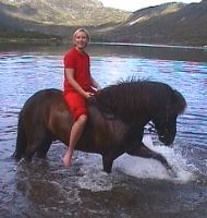Eivindur enjoys the water in a mountain lake